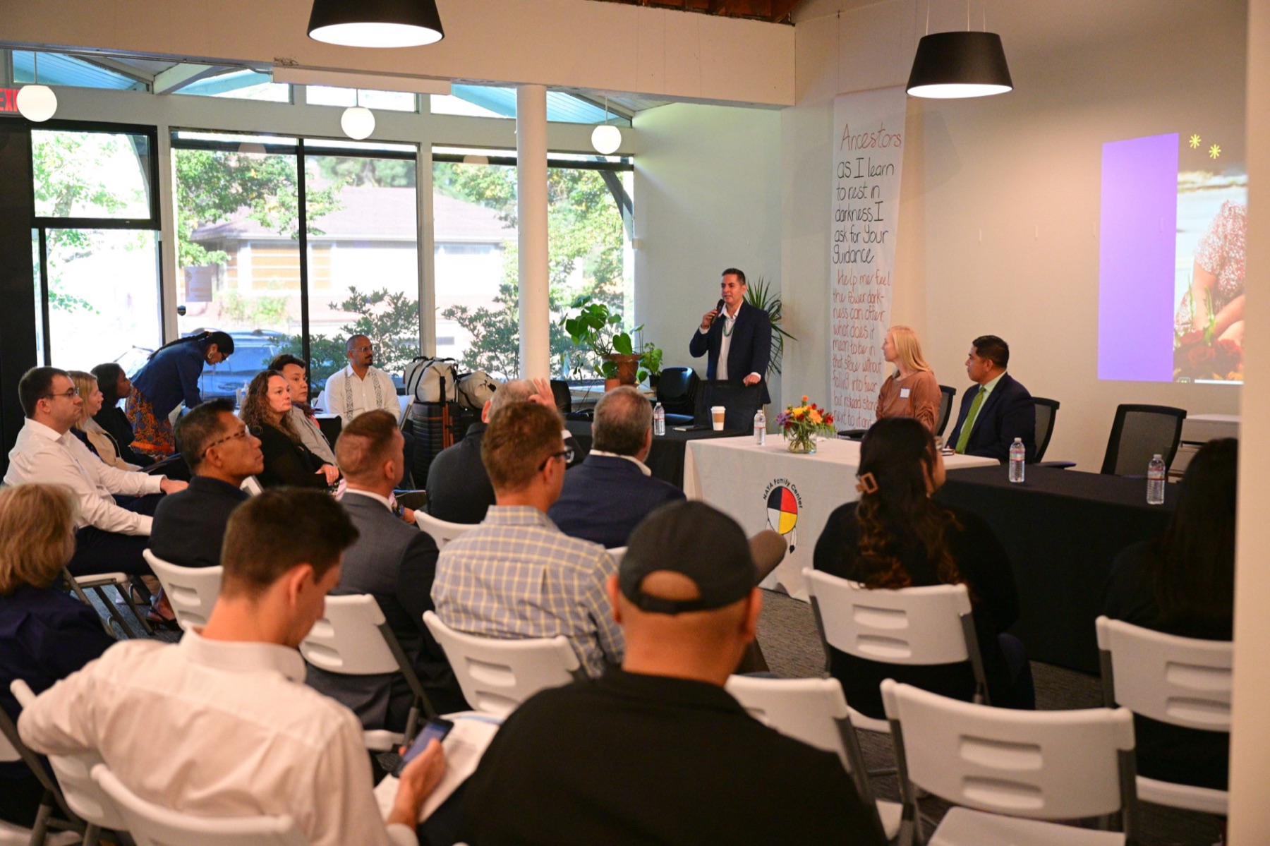 A speaker addresses Tribal housing leaders and partners at the Portland Tribal Housing Solutions Roundtable