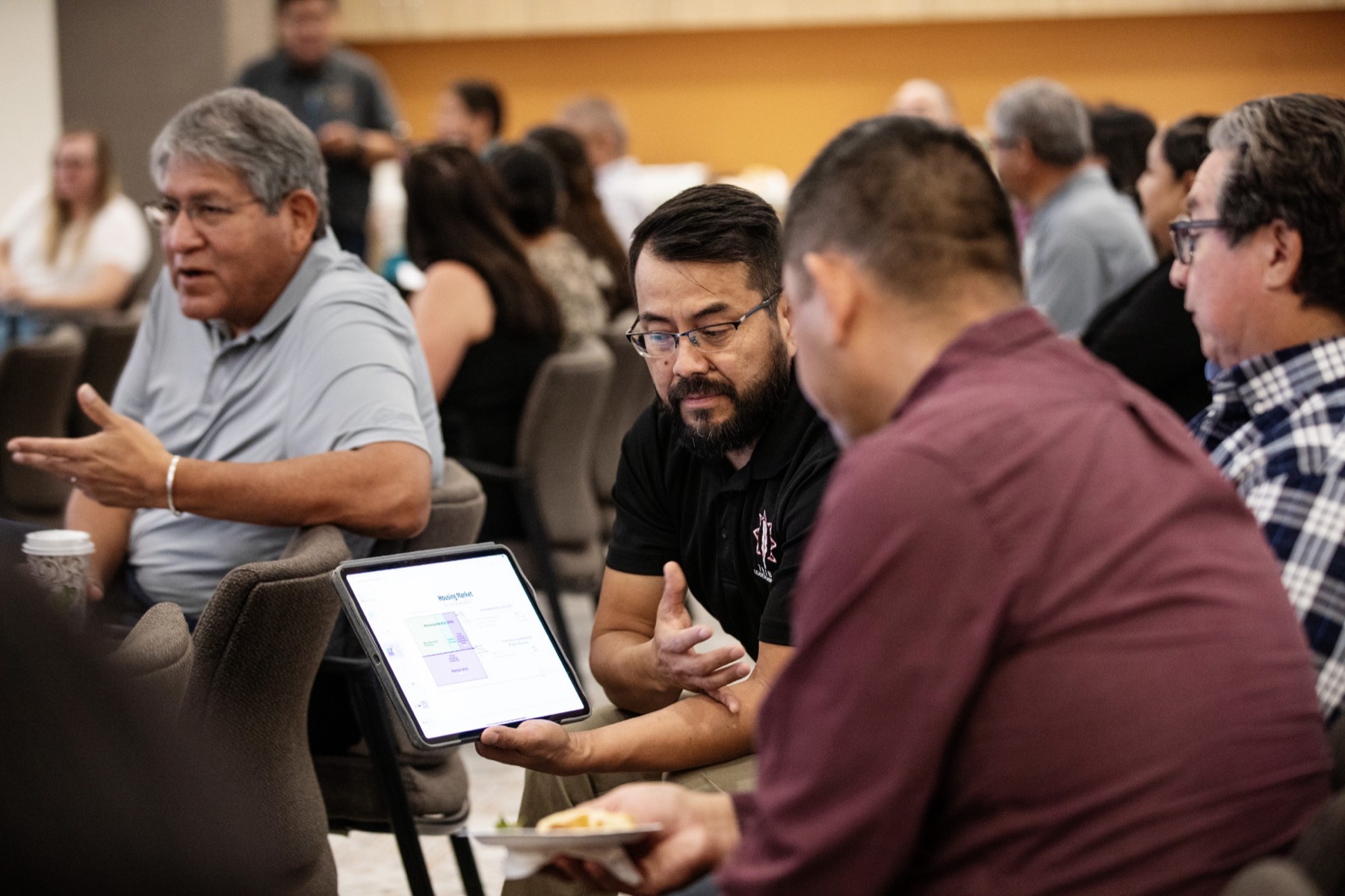 Attendees in small-group discussion at a NAIHC roundtable